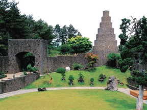 Spirited Garden on Jeju Island is a transformed wasteland filled with bonsai and surrounded by a tall basalt wall built by the garden’s creator.