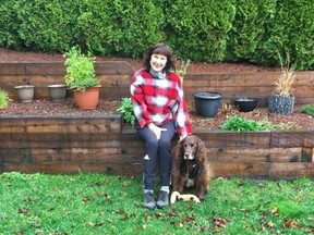 Lynne Smith and her dog Chester pose in this undated handout photo. Smith has applied for a job at a long-term care facility in Abbotsford, B.C., and says she'll even clean toilets so she can see her husband.