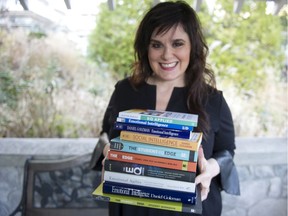 Carolyn Stern, a professor at Capilano University sees COVID-19 as a sort of gift that could allow students to develop their emotional intelligence and empathy. She is pictured holding a collection of her favourite books on the subject.