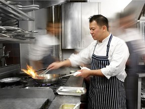 Chef Montgomery Lau in the Bacchus kitchen during pre-COVID times.