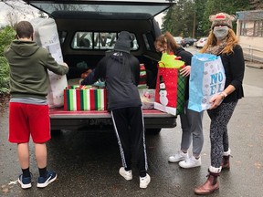 Karin Leathwood (right) and crew from Coquitlam’s Encompass Alternative program delivering a bed and bedding to a student in need before school ended this week.
