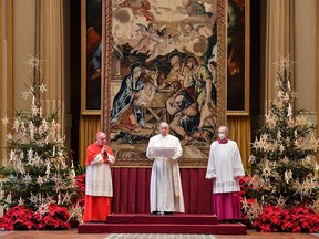 This handout photo taken on December 25, 2020, and released by the Vatican press office, shows Pope Francis delivering his streamed Urbi et Orbi blessing from the Vatican Blessing hall.