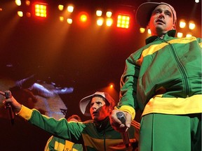 Beastie Boys Mike D (Michael Diamond) and Ad Rock (Adam Horovitz) strike a pose during a September 2004 concert at the Pacific Coliseum.