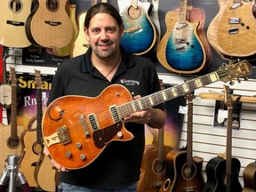 Mike Miltimore says the Gretsch electric guitar that a woman brought into his store is from 1955 and similar to one played by country music legend Chet Atkins before he developed his signature series of guitars.