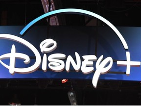 In this file photo taken on August 23, 2019 a Disney+ streaming service sign is pictured at the D23 Expo, billed as the "largest Disney fan event in the world," at the Anaheim Convention Center in Anaheim, California.