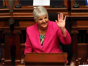 Minister of Finance Carole James waves to people in the sitting area before she delivers her budget speech from the legislative assembly at B.C. Legislature in Victoria, B.C., on Tuesday, February 18, 2020.