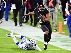 Running back J.K. Dobbins of the Baltimore Ravens leaves Dallas Cowboys safety Darian Thompson in the dust last week at M&T Bank Stadium. The struggling Cowboys  slipped to 3-9 in NFL play.