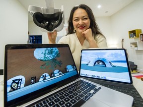 Debi Wong with virtual reality headgear at her home in Vancouver. Wong is the director of an indie opera company and has assembled a virtual reality time capsule of artists reflecting on their experiences during 2020.