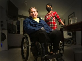 Mike Hamill with nurse Daisy Chand at his home in Ladner. Hamill, a paraplegic since a whale-on-boat accident three years ago that broke his back in three places, had his wheelchair hoist stolen from the underground garage at his condo.