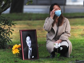 Krystell Peralta at the gravesite of her brother Kevin on Dec. 20, 2020. Kevin had spent five years at the George Pearson Centre in Vancouver, a long-term care home owned and operated by Vancouver Coastal Health for people with complex care needs. Kevin, 28, died in hospital on Aug. 23 of dehydration and multiple infections.