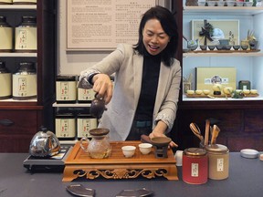 Olivia Chan with with her special "Founder's Blend" tea, a blend created by a tea farmer in China who came out of retirement in October to help people through the difficult times of COVID-19.