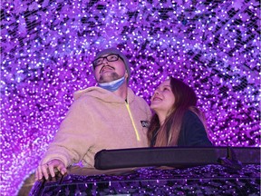 Shieran Cobb (left) and his girlfriend Alyssa Gobeil take in the PNE's WinterLights Christmas event in Vancouver, BC, December, 23, 2020.