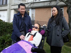 Tuan Bui, left, and Kairry Nguyen with their daughter Leila Bui outside the Victoria courthouse in January 2020 after Tenessa Nikirk was found guilty in the Saanich crash that catastrophically injured Leila.