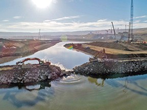 On Oct. 3, 2020, the final rock materials were placed to complete the rock-fill berm, initiating full diversion of the Peace River on the Site C dam project.