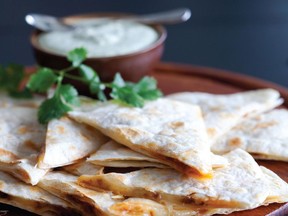 Susan Meister’s Chorizo Quesadillas are filled with sausage and Monterey Jack cheese and served with a creamy cilantro dipping sauce.