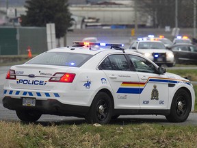 File photo of RCMP vehicles at a crime scene.