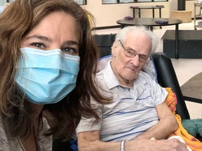 Melanie Behm (L) is shown with her grandfather Jim Wood (R) in an undated family photo. Behm is furious that Alberta MLAs and government staff members flouted the spirit of Alberta's COVID-19 restrictions to travel to sunny vacation spots, while she was not allowed to visit her grandfather who lives in Edmonton, like her.