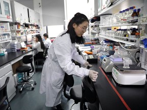 Dr. Shuhui Sun performs histological staining of mouse liver for pathological analysis in the Aging and Regeneration lab at the Institute for Stem Cell and Regeneration of the Chinese Academy of Sciences in Beijing, China, on Jan.12, 2021.