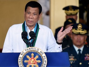 FILE PHOTO: Philippine President Rodrigo Duterte gestures during the change of command ceremony of the Armed Forces of the Philippines (AFP) at Camp Aguinaldo in Quezon City, Metro Manila, Philippines April 18, 2018.