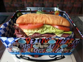 The Dagwood, a sandwich with assorted deli meats on a ciabatta bun.