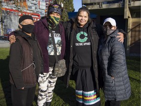 Jamie Smallboy (second from right) with founding members of the Women’s Memorial March (from left) Veronica, Carol Martin and Skundaal.