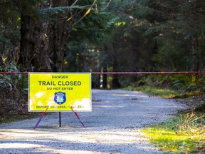 Signs warning Stanley Park walkers and joggers to stay off the trail. There's been reports of aggressive coyotes on some of the trails.