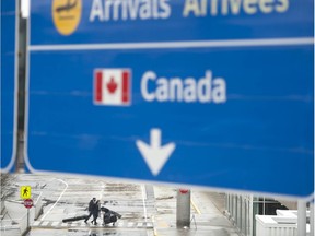 Travellers at Vancouver International Airport earlier this week. The federal government has announced new restrictions impacting Canadians returning home.