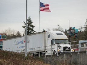 Trucks cross the U.S.-Canada border at 176th street in Surrey on Jan. 26.