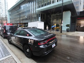 Vancouver Police on scene at Telus Gardens at 777 Richards St. in Vancouver on Sunday.