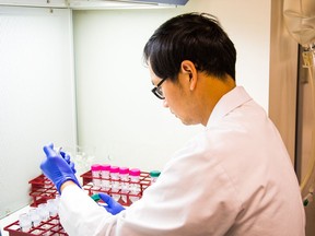 Handout photo of a scientist working in a lab at Vancouver-based Acuitas Therapeutics.