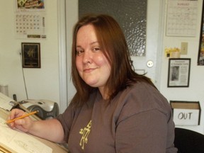 Vancouver-based comics artist Pia Guerra at work, circa 2005. The ‘pencil jockey’ has since moved into the field of editorial cartooning with her work featured in the New Yorker, MAD Magazine and elsewhere.