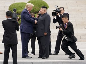 FILE PHOTO: U.S. President Donald Trump meets with North Korean leader Kim Jong Un at the demilitarized zone separating the two Koreas, in Panmunjom, South Korea, June 30, 2019.