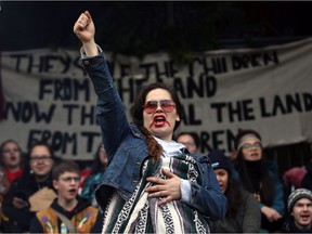 Wet'suwet'en supporter Leah Melville chants with protesters on the steps of legislature before the throne speech in Victoria, on Tuesday, February 11, 2020.
