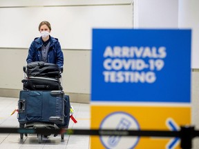 A passenger arrives at Toronto's Pearson airport after mandatory COVID-19 testing took effect for international arrivals in Mississauga, Ontario, February 1, 2021.