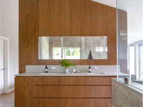 Standalone bathroom vanity with plenty of space surrounding it for those with mobility devices.