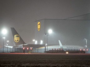 Snow falls at the United Parcel Service (UPS) WorldPort hub located at Louisville Muhammad Ali International Airport in Louisville, Kentucky, U.S., February 15, 2021. For the first time in history, UPS has closed the WorldPort hub, suspending all sorting and flight operations because of weather.