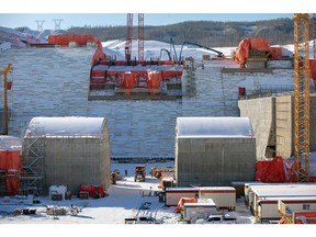 Crews pour concrete at the lower level spillway gates at Site C. The dam spillways will allow the passage of large volumes of water from the reservoir into the river channel downstream.