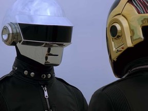 This screengrab shows members of Daft Punk taken from a video titled "Epilogue" posted shared on their YouTube channel.
