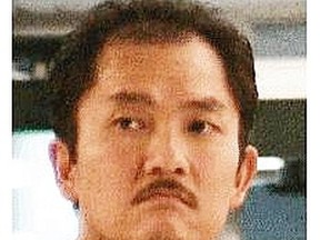 Khamla Wong, who has links to the United Nations gang, is wanted by B.C. police for international drug smuggling. For a Kim Bolan story. [PNG Merlin Archive]