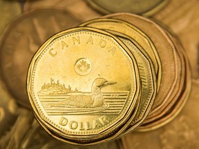 The Canadian dollar topped 80 U.S. cents for the first time in three years Thursday.