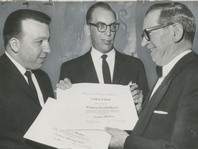 Vancouver Sun photographer Ken Oakes (left) and reporter Arnie Myers (middle) receive National Newspaper Awards from trustee James Kingbury in Toronto on April 16, 1966.