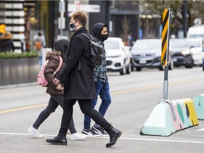 People wearing masks in downtown Vancouver.