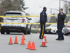 Surrey, BC: FEBRUARY 04, 2021 -- RCMP at the scene of a fatal shooting at 139A Street and 108th Avenue in Surrey, BC Thursday, February 4, 2021. It is assumed the orange pylons are evidence markers.



(Photo by Jason Payne/ PNG)

(For story by reporter) ORG XMIT: surreyshooting [PNG Merlin Archive]