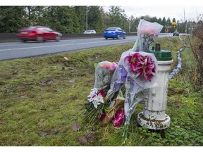 Memorial flowers along the Barnet Highway in Burnaby near the spot where Nicole Hasselmann died in 2018 following a car crash.