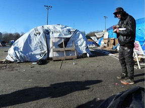 Taze Haasbeek outside his tent at Strathcona Park as temperatures are expected to drop to -10c overnight  in Vancouver.