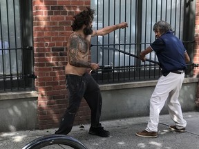 Neal Hall took a picture of this confrontation in the Downtown Eastside. Police came but felt there was nothing they could do.