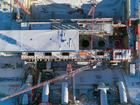 Aerial view of penstocks under construction. A penstock is a large steel pipe in a hydroelectric generating station that brings water from the reservoir to a turbine.