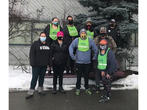 Sharon Duffy (in orange cap) leads this year's Nenqayni Wellness Virtual team in the Vancouver Sun Run Virtual Race. Pictured are nine of the 17 team members, four of whom are doing the Sun Run for the first time.
