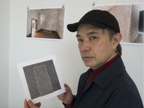 Ho Tam, director of Hotam Press, holds a drawing from a work called Baridegi (A Hole is Born) by Sun Yung Shin and Jinny Yu, at the 218 East 4th Ave. gallery in Vancouver on March 23. Baridegi, a collection of drawings and poetry, is part of an exhibit called Guesthood and Alienhood.