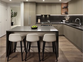 Buyers can opt for one of two colour palettes on offer at Boffo's latest development. Dark quartz countertops and backsplashes along with flat-slab taupe cabinetry and walnut-tone wide-plank laminate flooring define the Smith option, pictured, on display at the presentation centre.